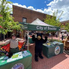 Education and Outreach staff at OSMP's booth at the Farmer's Market.