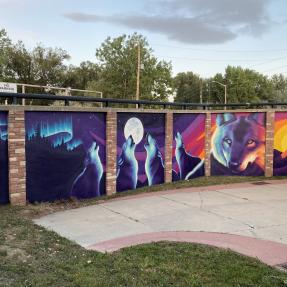 Colorful mural of wolves