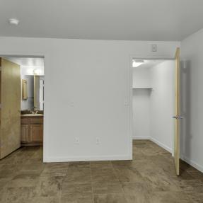 15-4730 Holiday Dr #101-bedroom with view to bathroom and walk in closet