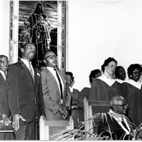 Rev. Hill and choir with stained glass window behind. May 1966. Boulder Daily Camera