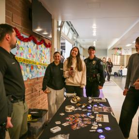 Boulder Police Officers and youth doing outreach at a spring lunch event.
