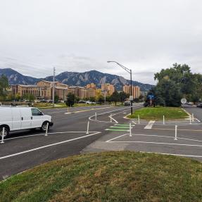 paint and flexible-post protected road with green bike crossing