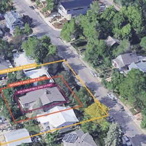 Aerial view of a suburban neighborhood showing three concentric defensible space zones overlaid on a single home.