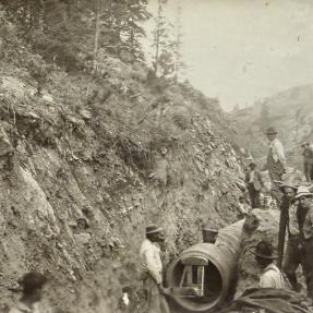 November 1909, workers laying the gravity pipeline.