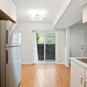 22-3315 Talisman Ct C-kitchen to dining sliding door to porch