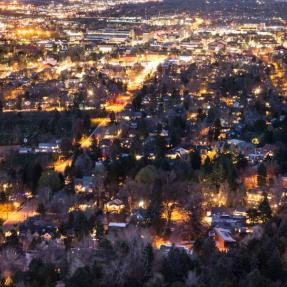 boulder with lights on at night