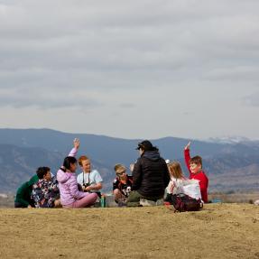 children on field trip in open space with OSMP rangers