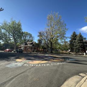 Cul-de-sac and street on Goss Grove with chalk painting in the center.