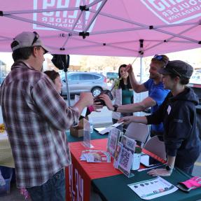 Community members picking up plants and seedlings at Tree Giveaway
