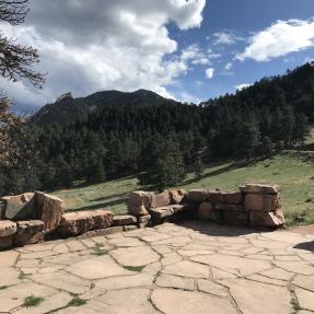 The Halfway House flagstone patio with the Flatirons in the background.