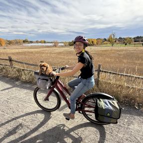 Rachel Alba with a dog and a bike