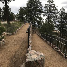 Viewed from the turn, a dirt ramp heads up to the left and down to the right.