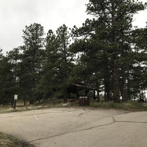 A few parking spaces with the Wood Shelter in the background