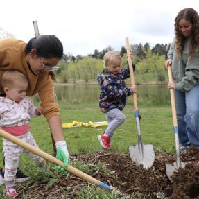 Children helping plant a tree