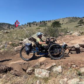 An adaptive mountain bike rider testing out a new section of North Foothills Trail.