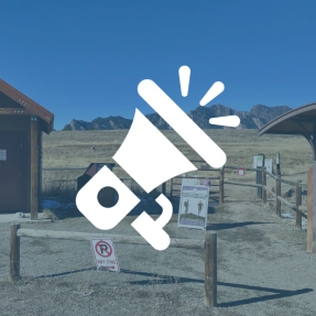 Trailhead with bathrooms and kiosk with map and information