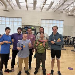 EXEXPAND participants show off their medals after the spinning Olympics