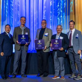 Representatives from the City of Boulder, BVSD and Flatirons Habitat accept BoulderMOD's Metro Vision Award.