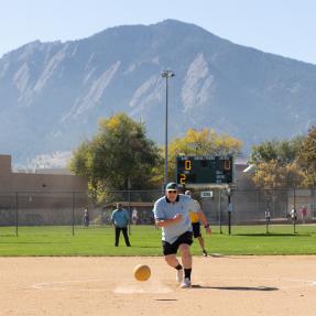 This image displays kickball play at East Mapleton