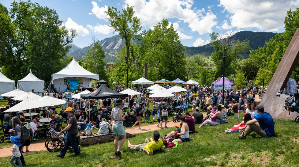 Community members visiting vendor tents at Boulder Creek Festival